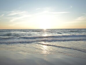 A beach with waves and a clear sky. - 6 Person Holiday Home in Lokken (Lokken)