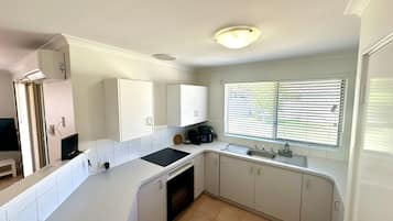 Microwave, oven, dining tables
