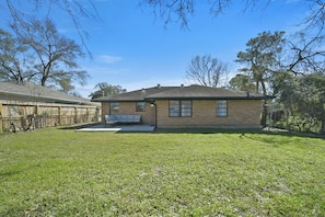 Terrace/patio - Private home sleeps 6 with fenced yard, fast WiFi, modern smart TVs, and ample parking + 2-car garage—near the Heights & Downtown. Includes a primary king ensuite for added privacy. (Houston)