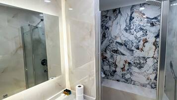 Eco-friendly toiletries, hair dryer, slippers, towels