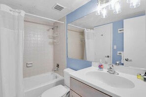 Shower, hair dryer, towels, shampoo