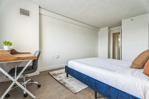 1 bedroom, desk, iron/ironing board, travel crib