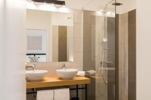 Shower, hair dryer, towels, toilet paper