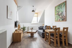 Standard Studio, 1 King Bed with Sofa bed, Sauna, City View | Living area - Loft Apartments (Leipzig)