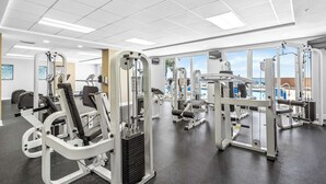 A gym with various exercise machines, large windows, and a view of the outdoors. - Beachfront with unbeatable views, 3BR 2BA Condo at Sunrise Beach! (Panama City Beach)