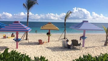 On the beach, sun loungers, beach towels