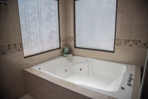 Jetted bath, towels, soap, toilet paper