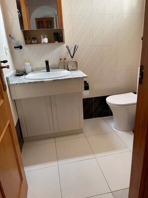 Shower, towels, soap, toilet paper