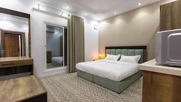 Roupas de cama premium, frigobar, roupa de cama