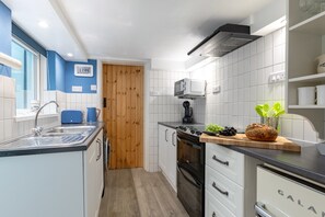 Fridge, microwave, oven, cookware/dishes/utensils