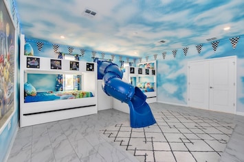 Sky-Themed Kids' Room with Slide and Bunk Beds