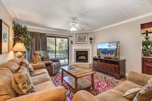 TV, fireplace - Cozy condo near downtown with balcony and stream sounds! (Gatlinburg)