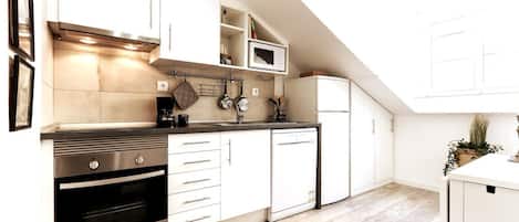 Fridge, microwave, stovetop, coffee/tea maker