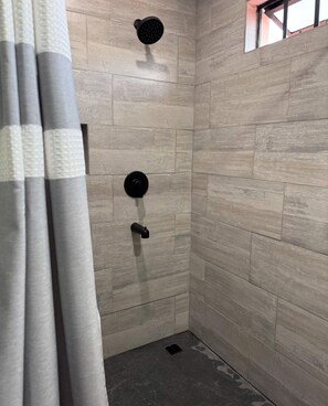 Shower, towels, soap, toilet paper