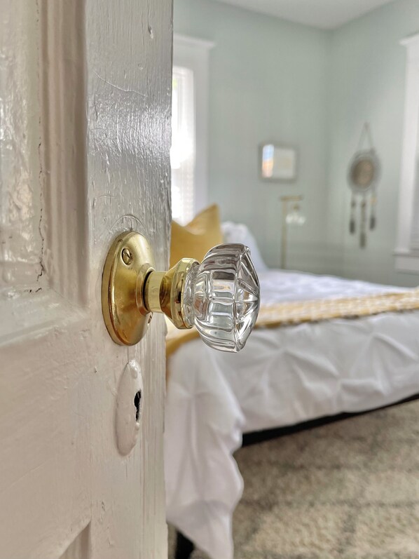 A door with a brass doorknob and a keyhole.