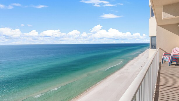 A balcony with a view of a beach and ocean. - Tidewater Escape: 1br/2ba Beachfront Condo, Sleeps 6, Gulf Views & Comfort! (Panama City Beach)