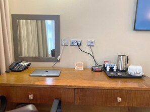 Work in comfort with a desk, telephone, and amenities at your fingertips.