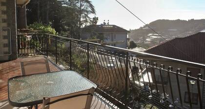 Two-room apartment surrounded by greenery, with large terrace overlooking the sea and private parking space,