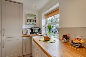 Fridge, oven, cookware/dishes/utensils
