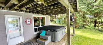 Lakeside Bliss Tait Lake – Cozy 3 Bed Cottage with Hot Tub & Private Waterfront!