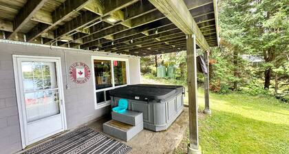 Lakeside Bliss Tait Lake – Cozy 3 Bed Cottage with Hot Tub & Private Waterfront!