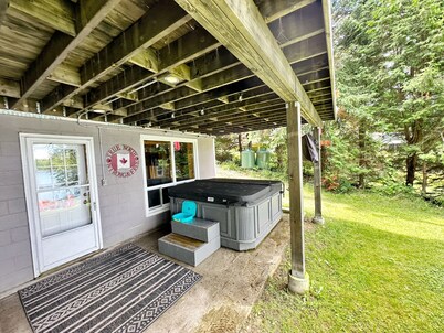 Lakeside Bliss Tait Lake – Cozy 3 Bed Cottage with Hot Tub & Private Waterfront!