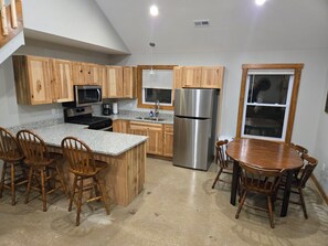 Fridge, microwave, oven, stovetop - Brightstone Lake Cabin 5 (Rensselaer)