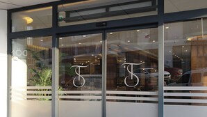 A hotel entrance with glass doors and a doormat reading "Tres Hotel". - Tress Hotel (Istanbul)