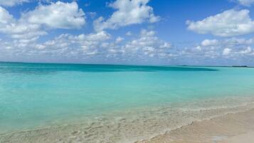 On the beach, sun loungers, beach towels