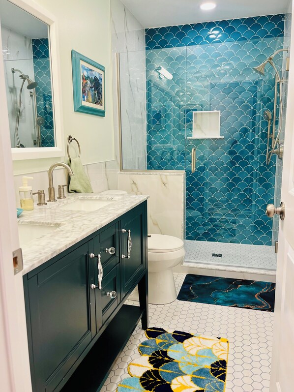 Shower, hair dryer, towels, soap