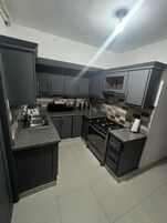 Family Penthouse, City View, Poolside | Private kitchen | Oven