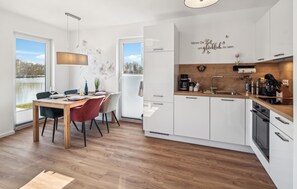 Fridge, stovetop, dishwasher, coffee/tea maker