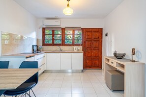 Fridge, stovetop, electric kettle, cookware/dishes/utensils