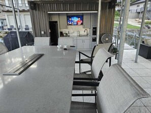 Outdoor dining - Luxurious indulgence in your very own, modern lakefront home (Gravois Mills)