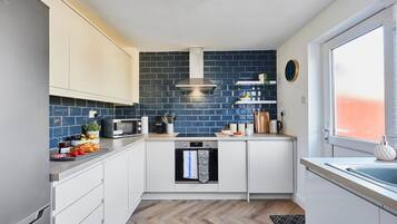 Fridge, high chair, cookware/dishes/utensils