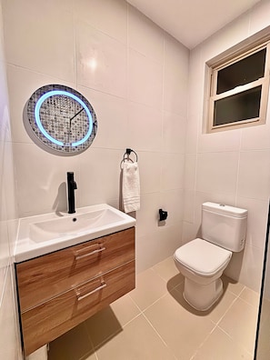 Shower, hair dryer, towels, soap