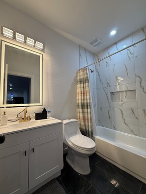 Shower, hair dryer, towels, soap