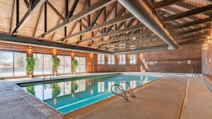 An indoor swimming pool with a wooden ceiling and large windows. - Hot Tub & Pool, Pickle Ball, Hiking/Fishing Close! (Durango)