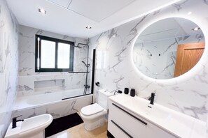 Shower, hair dryer, towels, shampoo