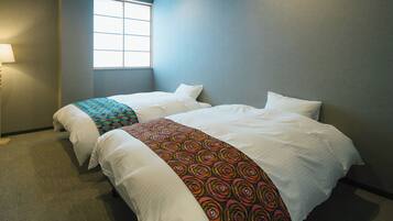 ベーシック ツインルーム | 遮光カーテン、WiFi (無料)、ベッドシーツ