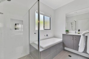 Shower, hair dryer, towels, shampoo