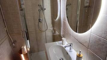 Shower, eco-friendly toiletries, hair dryer, bidet