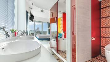 Deluxe Room | Bathroom | Hair dryer, slippers, towels, shampoo