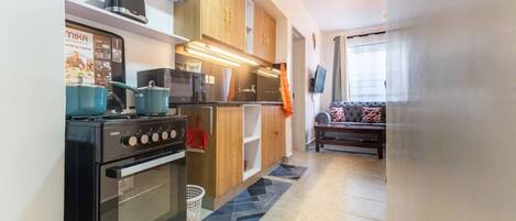 Fridge, microwave, stovetop, coffee/tea maker