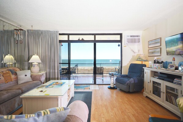 Living area - Exquisite, stylish 2 bedroom oceanfront condo great for families with free WiFi, an outdoor pool, and fabulous ocean view located uptown just steps to the beach! (Ocean City)