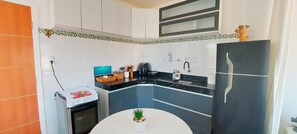 Apartment | Private kitchen | Fridge, coffee/tea maker, cookware/dishes/utensils, dining tables