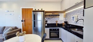 Panoramic Apartment | Private kitchen | Fridge, coffee/tea maker, cookware/dishes/utensils, dining tables - COPFL0100 - Condomínio Recanto do Flamengo (Salvador)
