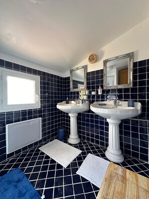 Shower, hair dryer, towels, toilet paper