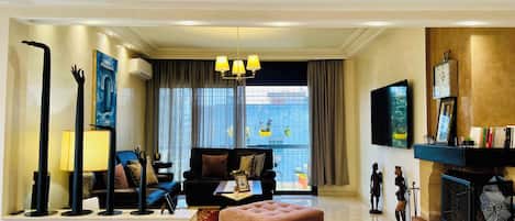 Smart TV, fireplace, books, computer monitors