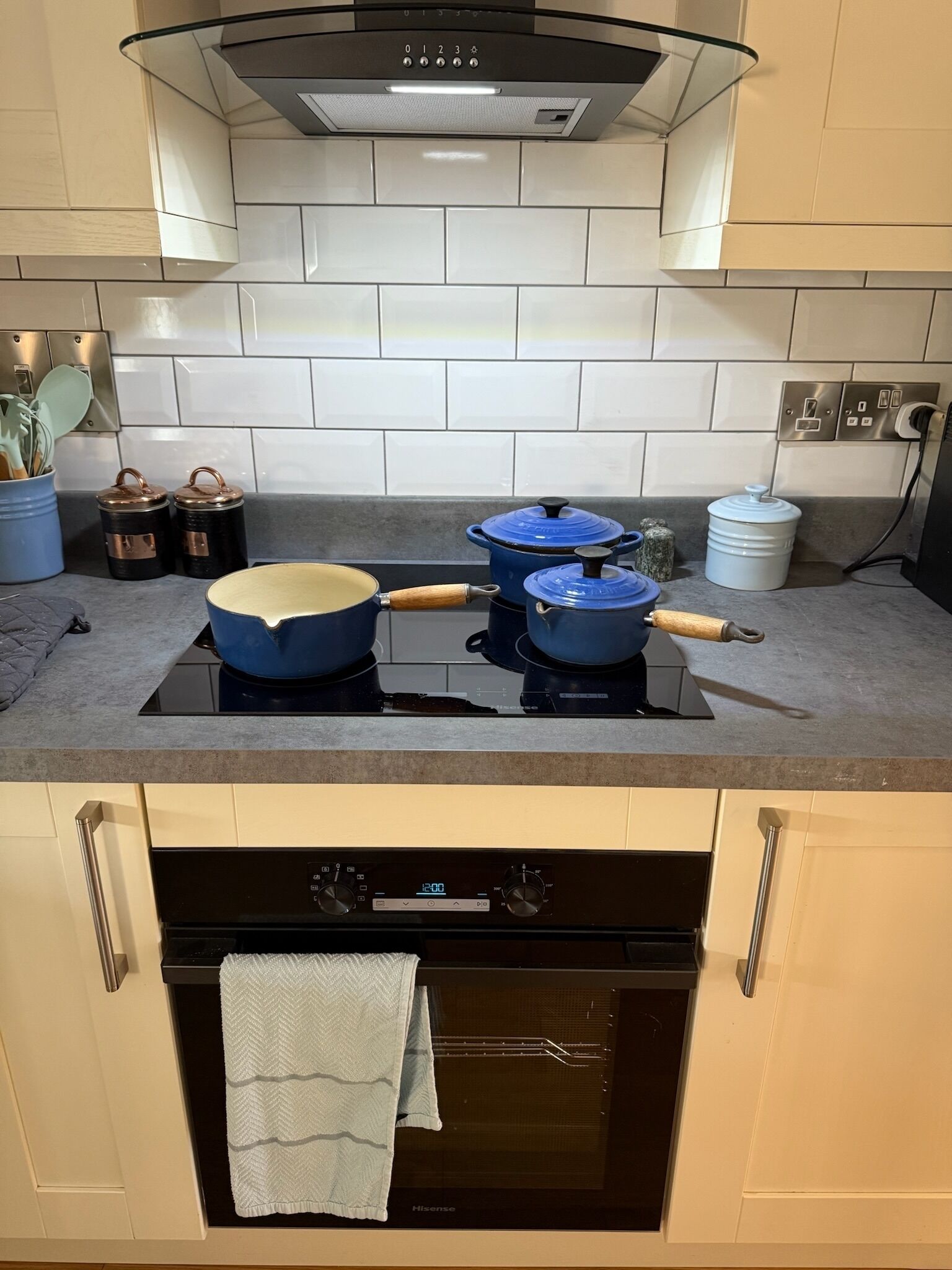 A kitchen with a gas stove, oven, and a microwave.